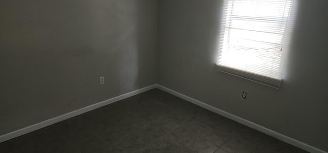 spare room featuring tile patterned flooring