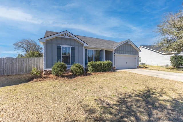 ranch-style house featuring board and batten siding, a front yard, and fence