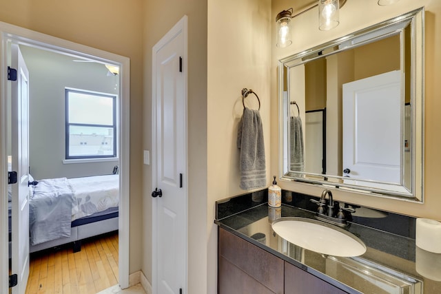 936 Broad St, Augusta, GA 30901 - bathroom with vanity, hardwood / wood-style flooring, and ensuite bathroom