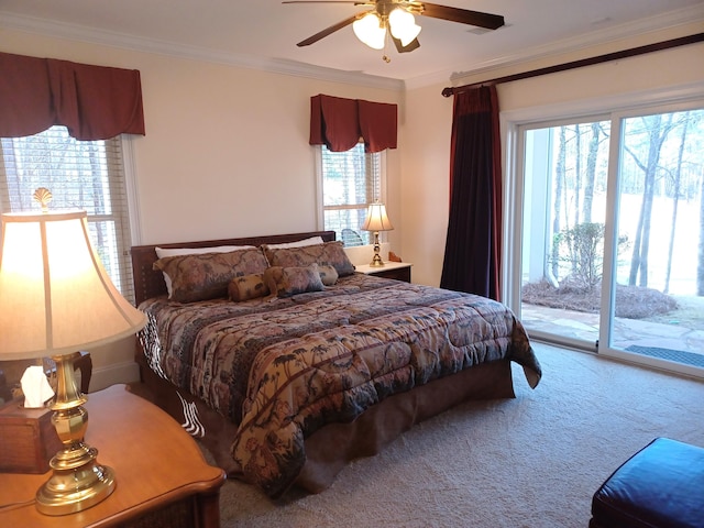 carpeted bedroom featuring access to exterior, ceiling fan, and ornamental molding