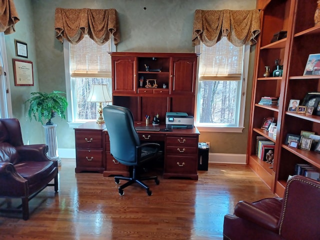 office featuring wood finished floors and baseboards