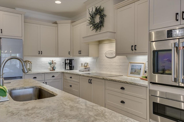 118 Bereau Dr, Mccormick, SC 29835 - kitchen with ornamental molding, a sink, stainless steel appliances, decorative backsplash, and light stone countertops
