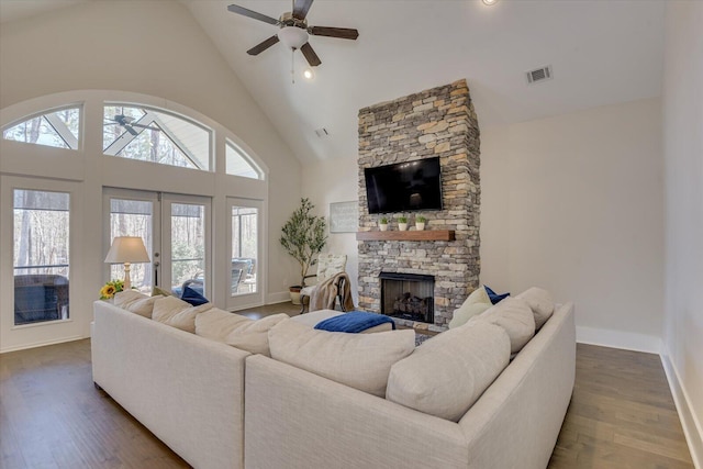 118 Bereau Dr, Mccormick, SC 29835 - living area with dark wood-style floors, a fireplace, high vaulted ceiling, and ceiling fan
