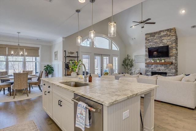 118 Bereau Dr, Mccormick, SC 29835 - kitchen featuring a sink, stainless steel dishwasher, a stone fireplace, and open floor plan