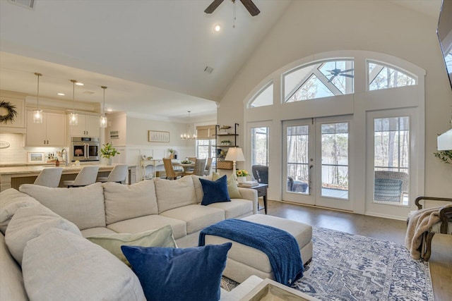 118 Bereau Dr, Mccormick, SC 29835 - living room with high vaulted ceiling, wood finished floors, visible vents, and ceiling fan