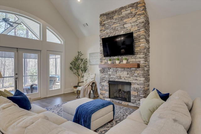 118 Bereau Dr, Mccormick, SC 29835 - living area with baseboards, a fireplace, french doors, wood finished floors, and high vaulted ceiling
