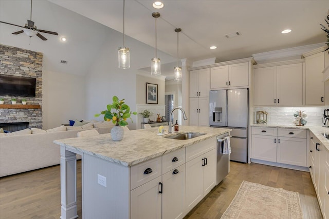 118 Bereau Dr, Mccormick, SC 29835 - kitchen featuring light wood-style flooring, a ceiling fan, a sink, open floor plan, and stainless steel appliances