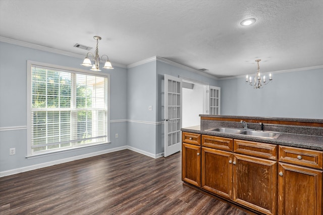 570 Lory Ln, Grovetown, GA 30813 - kitchen featuring a chandelier, dark wood-style floors, dark countertops, a textured ceiling, and pendant lighting