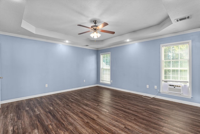 570 Lory Ln, Grovetown, GA 30813 - unfurnished room with a raised ceiling, healthy amount of natural light, cooling unit, dark wood finished floors, and crown molding