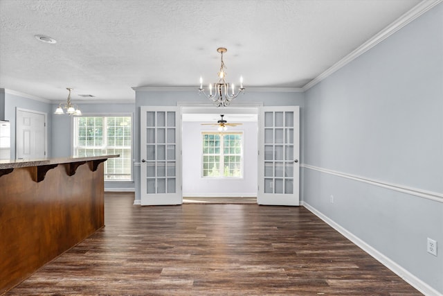 570 Lory Ln, Grovetown, GA 30813 - unfurnished dining area featuring a chandelier, french doors, healthy amount of natural light, crown molding, and a textured ceiling