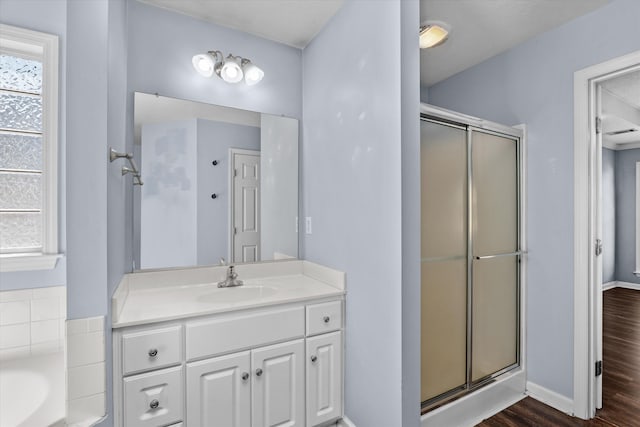 570 Lory Ln, Grovetown, GA 30813 - full bath with a stall shower, vanity, wood finished floors, and a garden tub
