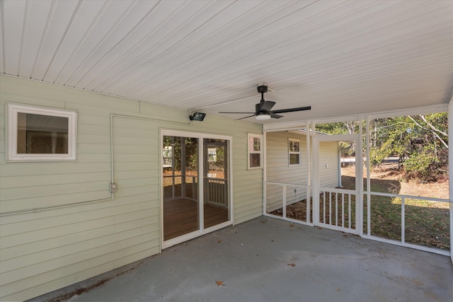 exterior space featuring ceiling fan