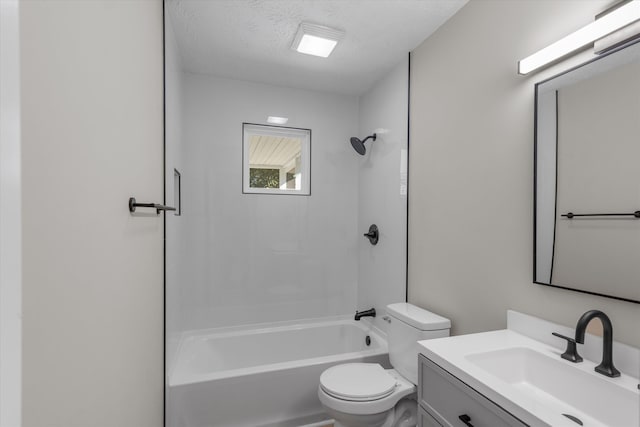 full bathroom featuring vanity, bathtub / shower combination, a textured ceiling, and toilet