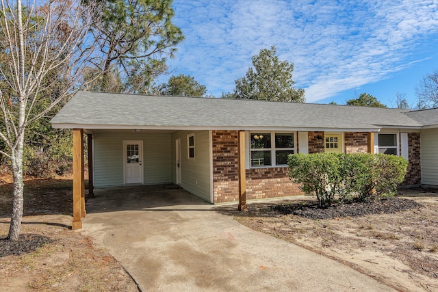 single story home with a carport