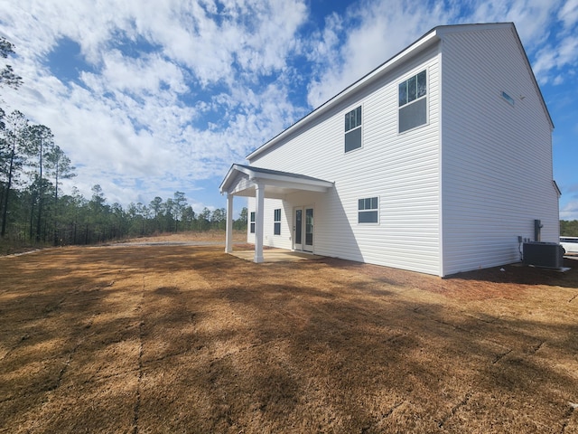 back of house with a patio and central air condition unit