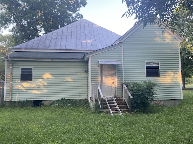 rear view of house with a lawn