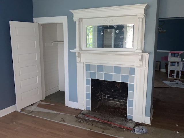 room details featuring wood-type flooring and a fireplace