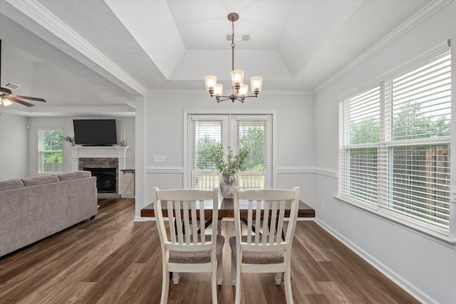 4894 Fairmont Dr, Graniteville, SC 29829 - dining space with a tray ceiling, plenty of natural light, a chandelier, dark wood-style flooring, and crown molding