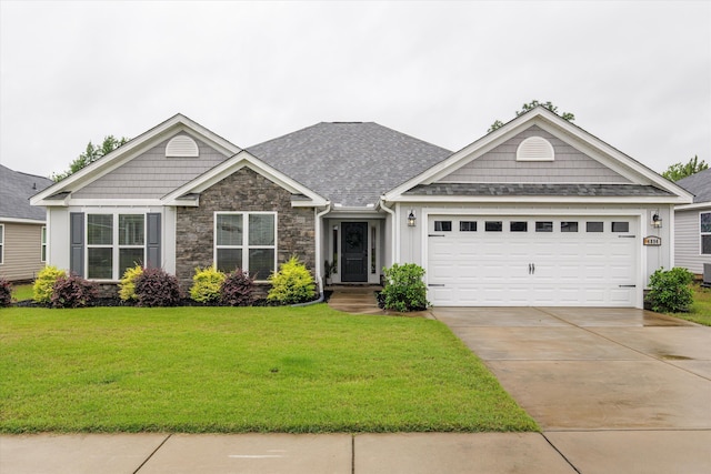 4894 Fairmont Dr, Graniteville, SC 29829 - view of front of house featuring stone siding, a front lawn, concrete driveway, a garage, and a shingled roof