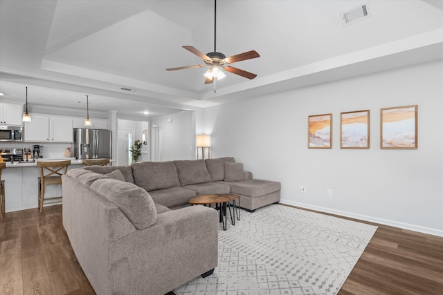 4894 Fairmont Dr, Graniteville, SC 29829 - living room with dark wood-style flooring, a tray ceiling, ceiling fan, baseboards, and recessed lighting