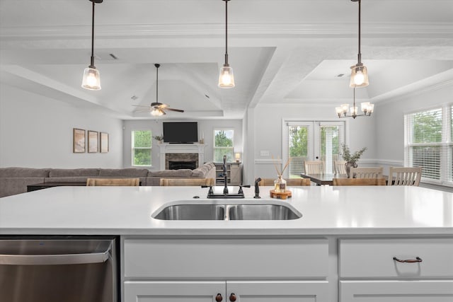 4894 Fairmont Dr, Graniteville, SC 29829 - kitchen featuring dishwasher, a tray ceiling, a sink, ceiling fan, and a fireplace