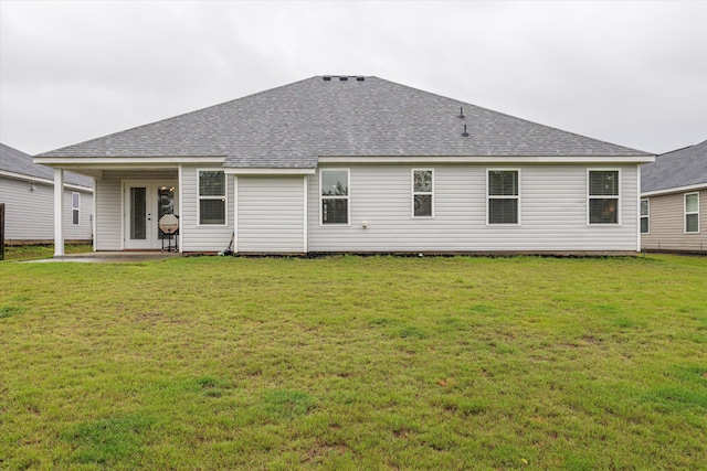 4894 Fairmont Dr, Graniteville, SC 29829 - rear view of house with a shingled roof, a lawn, and a patio area
