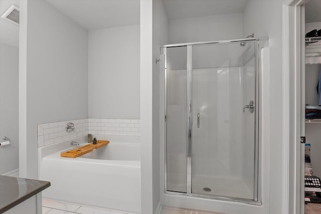 4894 Fairmont Dr, Graniteville, SC 29829 - full bath featuring a stall shower, a garden tub, vanity, and a spacious closet