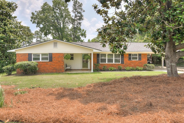 3202 Norris Ct, Augusta, GA 30907 - ranch-style house with brick siding, a front yard, a patio, and a shingled roof
