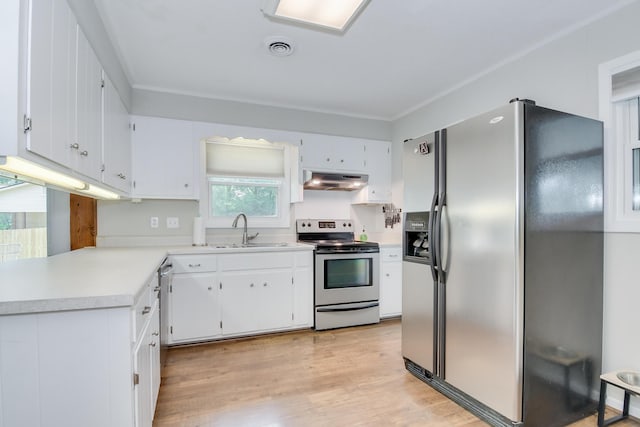 3202 Norris Ct, Augusta, GA 30907 - kitchen with stainless steel appliances, a sink, under cabinet range hood, light countertops, and white cabinets