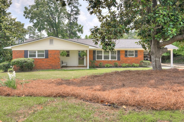 3202 Norris Ct, Augusta, GA 30907 - ranch-style house with brick siding, a front yard, and a shingled roof