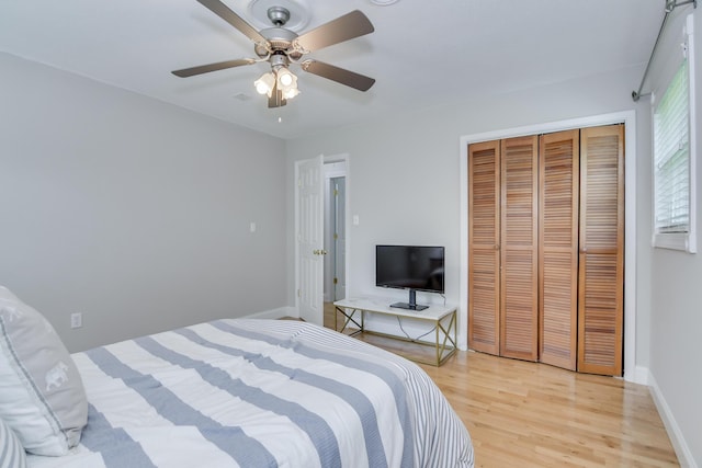 3202 Norris Ct, Augusta, GA 30907 - bedroom featuring light wood-style floors, a closet, ceiling fan, and baseboards