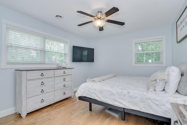 3202 Norris Ct, Augusta, GA 30907 - bedroom with multiple windows, light wood-style flooring, ceiling fan, and baseboards