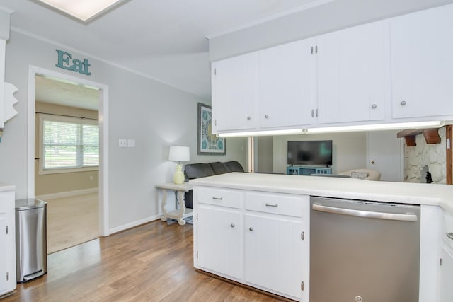 3202 Norris Ct, Augusta, GA 30907 - kitchen featuring stainless steel dishwasher, light countertops, light wood-style flooring, and white cabinetry