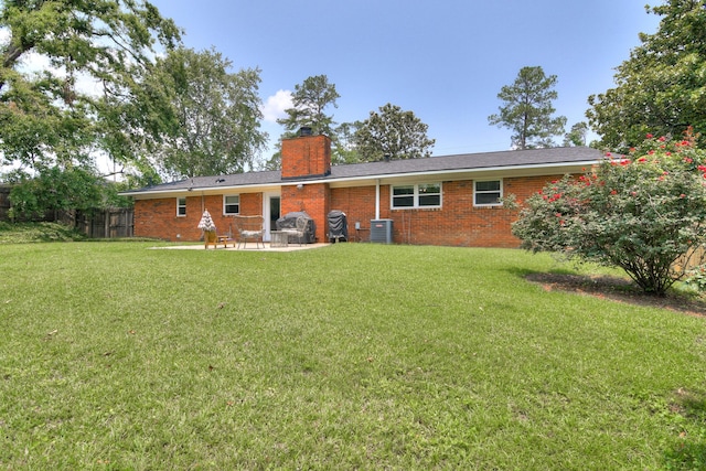 3202 Norris Ct, Augusta, GA 30907 - rear view of house featuring central air condition unit, a patio, a chimney, and brick siding