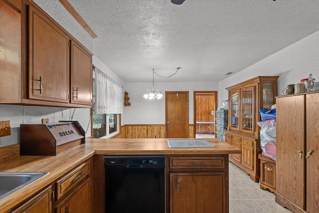 464 Rachel Dr, Evans, GA 30809 - kitchen featuring black dishwasher, a peninsula, wallpapered walls, wood counters, and a chandelier