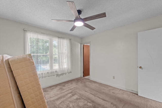 464 Rachel Dr, Evans, GA 30809 - empty room with ceiling fan, light carpet, and a textured ceiling