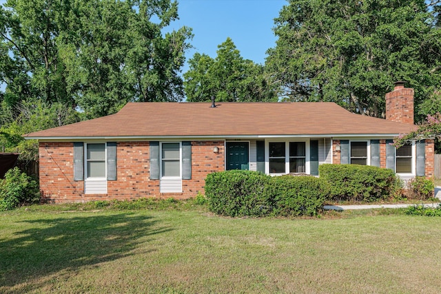 464 Rachel Dr, Evans, GA 30809 - ranch-style house with a chimney, a front yard, and brick siding
