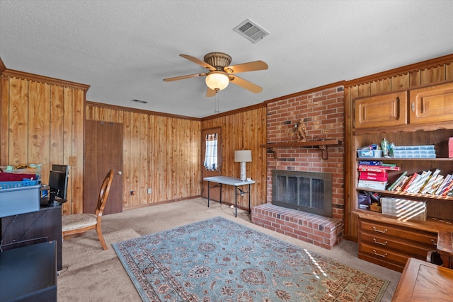 464 Rachel Dr, Evans, GA 30809 - office area with ceiling fan, carpet floors, ornamental molding, wooden walls, and a fireplace