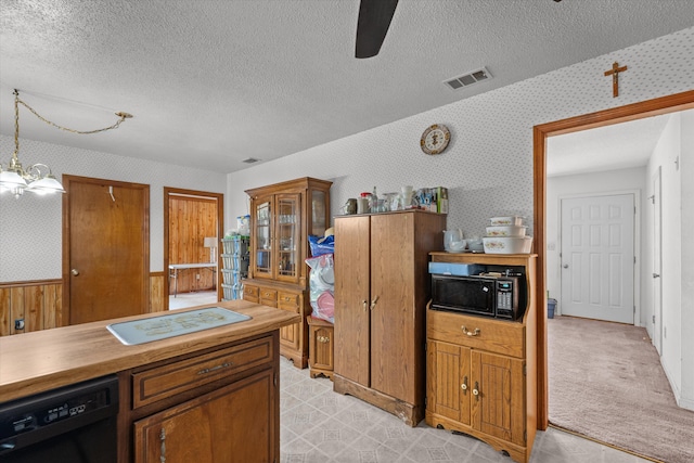 464 Rachel Dr, Evans, GA 30809 - kitchen with black appliances, wallpapered walls, a ceiling fan, a textured ceiling, and brown cabinetry