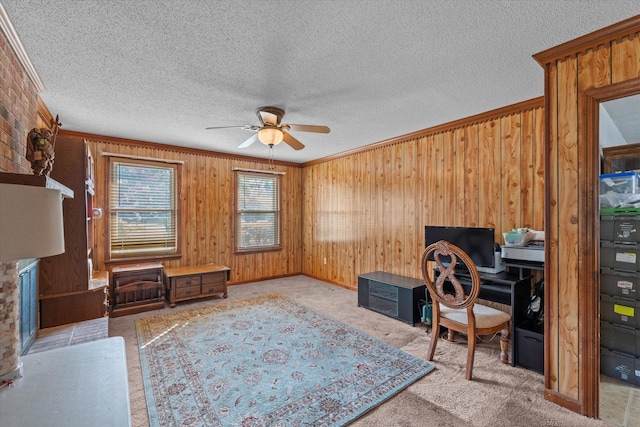 464 Rachel Dr, Evans, GA 30809 - office featuring a ceiling fan, ornamental molding, wood walls, carpet flooring, and a textured ceiling