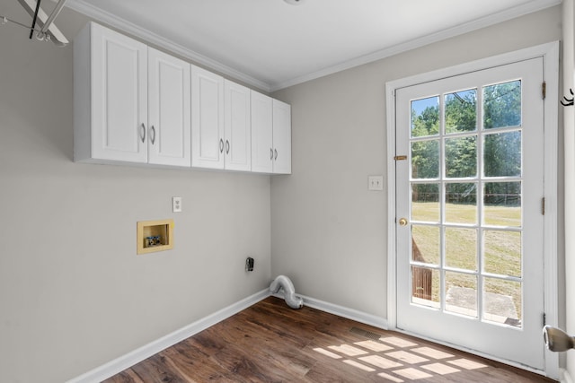 laundry area featuring dark wood-type flooring, crown molding, hookup for a washing machine, and cabinets