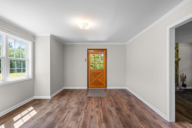 foyer entrance featuring ornamental molding and dark wood-type flooring