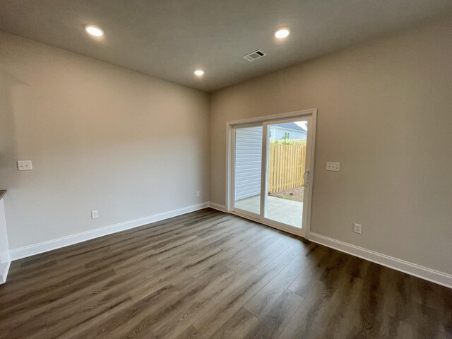 unfurnished room featuring dark hardwood / wood-style floors