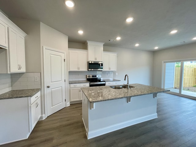 kitchen with white cabinets, sink, and stainless steel appliances