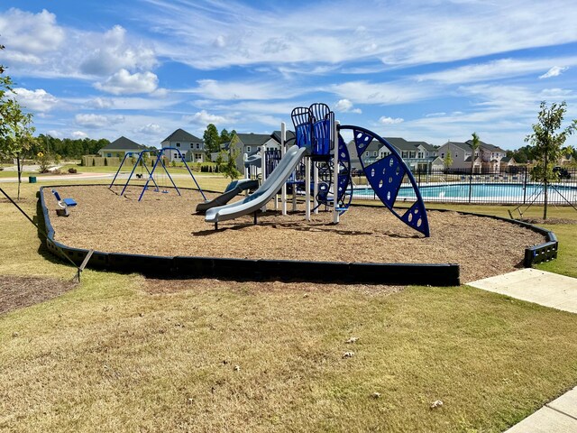 view of playground featuring a lawn