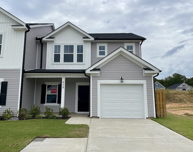 view of front of house with a front lawn and a garage