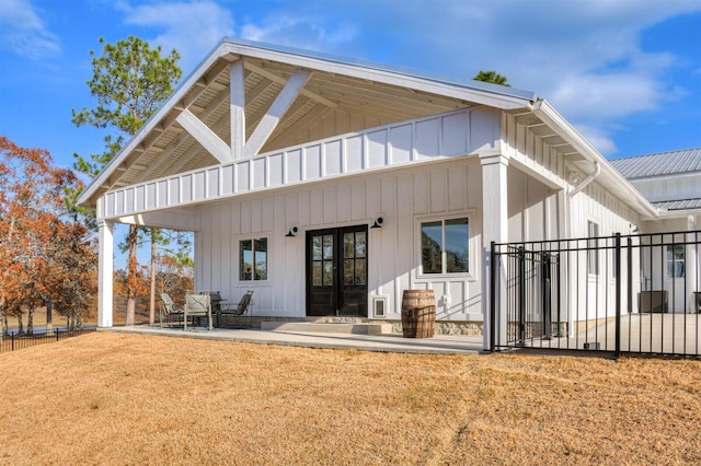 rear view of house with french doors and a patio