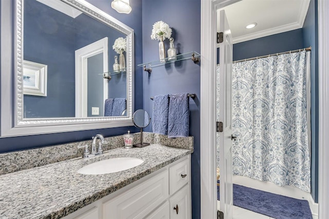 bathroom with vanity, walk in shower, and ornamental molding