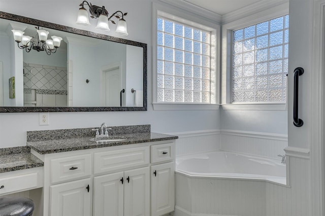 bathroom with vanity, shower with separate bathtub, and a chandelier