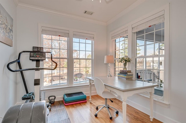 office area with ornamental molding and hardwood / wood-style flooring